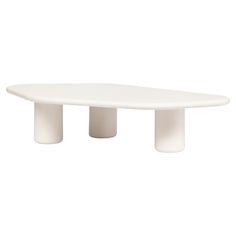 an oval white table with three legs on the top and one leg raised to the side