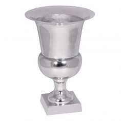 a silver vase sitting on top of a metal stand