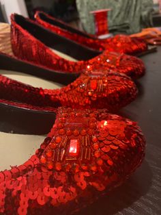 Handmade ruby slippers - just like Dorothy wears in The Wizard Of Oz. Very comfortable - great for costume parties, cosplay or theatrical productions.  Alternative colours and minor modifications available on request. Handmade by me in Melbourne, Australia. Each shoe takes about 3-4 hours to complete. (One pair 6-7 hours), excluding all the undercoating. I do my very best to get these shoes as close as possible to the original designs. I even use the original blueprints for the bows. Available s Ruby Slippers Wizard Of Oz, Wizard Of Oz Shoes, Grad Shoes, Silver Slippers, Womens Costumes, Shiny Shoes, Ruby Slippers, Costume Parties, The Wizard Of Oz