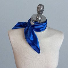 Simple and elegant neck scarf. Made of soft satin.  Color: royal blue (other colors are available) Size: 50 x 50 cm We have matching bags and other accessories in our Etsy Shop! We accept credit cards! Trendy Blue Scarf As Gift, Chic Blue Silk Scarf As Gift, Elegant Blue Scarves For Party, Trendy Blue Scarf For Gift, Satin Silk Scarf Gift, Chic Blue Scarves For Gifts, Blue Square Scarves As Gift, Square Satin Scarves Gift, Trendy Blue Scarves For Gifts