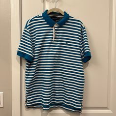 Nwot Tommy Hilfiger Polo Shirt. Short Sleeve Polo, Button At Top, Turquoise And White Stripe Polo. Men’s- Size Large, 100% Cotton. Casual Fitted Tommy Hilfiger Polo Shirt, Preppy Blue Top With Buttons, Casual Tommy Hilfiger Tops With Buttons, Fitted Tommy Hilfiger Casual Polo Shirt, Casual Tommy Hilfiger Polo Shirt, Blue Polo Collar Top With Buttons, Casual Blue Tommy Hilfiger Tops, Blue Cotton Top With Striped Collar, Tommy Hilfiger Collared Top With Button Closure