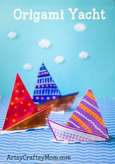 three paper boats are sitting on the table