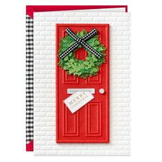 a red door with a wreath on it