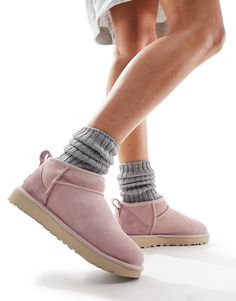 Slippers by UGG Good things come in pairs Pull tab for easy entry Signature UGG branding Round toe Treadlite by UGG™ outsole Textured tread Uggs Ultra Mini, Pink Suede Boots, Classic Boots Woman, Ultra Mini Boots, Pink Ugg Boots, Ugg Ultra Mini, Mini Boots, Pink Uggs, Ugg Winter Boots