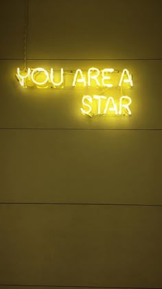 a neon sign that says you are a star