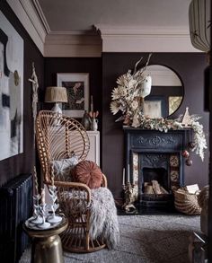 a living room filled with furniture and a fire place next to a wall mounted mirror