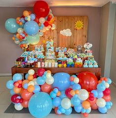 an assortment of balloons are on display at a birthday party