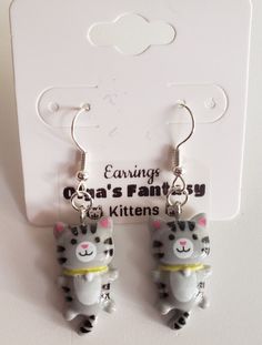 New with tag Cute Gray Cats Kittens Earrings Plastic and Metal; Nice for girls of all ages; Measurements: Length of the whole earrings 1.5" Length of the cat 1.0" Cute Cat Design Earrings For Gift, White Cat Design Earrings, Cute Cat Design Drop Earrings, Gray Cats, Kitten Earrings, Silver Cat Design Dangle Earrings, Earrings For Girls, Cats Kittens, Handcrafted Artisan Jewelry