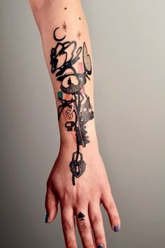 a woman's hand with a tattoo on it