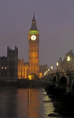 the big ben clock tower towering over the city of london, england at night time