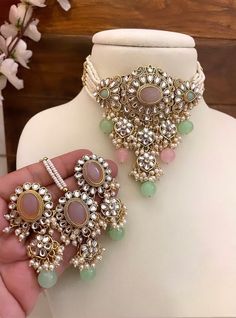 Adorn yourself in timeless elegance with this exquisite mint pink Kundan necklace set, perfect for weddings and special occasions. Crafted with meticulous attention to detail, the set features delicate mint pink hues reminiscent of Pakistani and Punjabi traditions, with a touch of Bollywood glamour. Complete with matching earrings and a stunning maangtika, this Indian Kundan ensemble effortlessly captures the essence of sophistication and grace. Measurements: Necklace Length-14" Earring Length- Pink Kundan Necklace For Wedding With Intricate Design, Green And Pink Jewellery Set, Mint Green Bridal Jewellery Set, Pink Kundan Jewelry Set With Meenakari, Mint Green Indian Jewellery, Stylish Jewelry Accessories, Indian Wedding Jewelry Sets, Indian Bridal Jewelry Sets, Diamond Pendants Designs