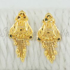 Celebrate the essence of Indian heritage with these radiant 22k gold earrings. Each earring is meticulously designed with traditional patterns that catch the light and add a regal touch to your look. Perfect for both festive occasions and elegant evenings, these earrings are a testament to the rich history of Indian jewelry, offering a blend of classic beauty and modern sophistication. 22k gold earrings handmade jewelry made in India Metal real gold, Purity 22k gold,  length is 2.8 centimeter an Festive 22k Yellow Gold Bridal Earrings, Gold Dual-tone Earrings For Formal Occasions, Gold Plated Earrings With Intricate Design For Puja, Gold Dual-tone Ceremonial Earrings, Gold Dual-tone Temple Jewelry Earrings, Gold Dual-tone Earrings For Ceremonial Occasions, 22k Gold Temple Jewelry Earrings With Elegant Design, Gold Dual-tone Danglers For Festive Occasions, 22k Gold Elegant Temple Jewelry Earrings