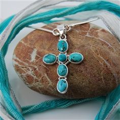 Tibetan Turquoise Sterling Silver Cross Pendant  P149 $74.95  Nicely designed and carefully crafted sterling silver cross pendant contains beautiful Tibetan Turquoise. This pretty piece will fit in with any wardrobe style and choice. Note that as a natural product the tone of the Tibetan turquoise will vary from pendant to pendant, however, care is taken to match all pieces on a single cross. Turquoise Cross Necklace, Tibetan Turquoise, Turquoise Cross, Jewelry Turquoise, Sterling Silver Cross Pendant, Southwest Jewelry, Silver Cross Pendant, Healing Jewelry, Sterling Silver Cross