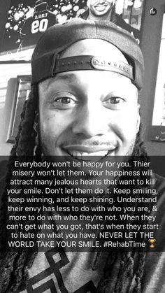 a man with dreadlocks smiles at the camera and has a quote on it