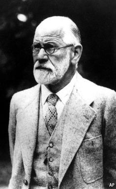 an old black and white photo of a man in a suit