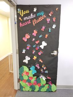 a door decorated with butterflies and the words you make my heart flutters