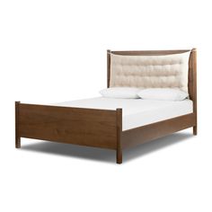 a bed with white pillows and wooden headboard on it's side, against a white background