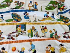 the children are playing with their toys on the bed sheet that is made out of fabric