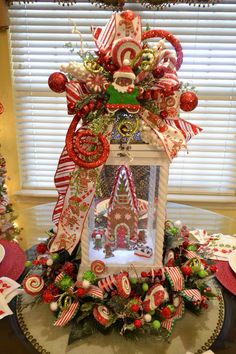 an elaborate christmas decoration on top of a table