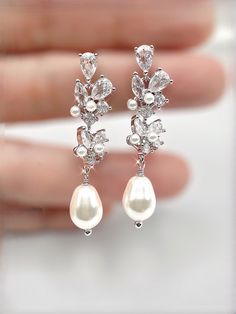 Bridal earrings Wedding jewelry Pearl earrings CZ AAA Wedding Statement Earrings, Bridal Dangle Earrings Bridal Jewelry Wedding Jewelry gift Make a statement on your special day with these Bridal Statement Earrings. These gorgeous dangle earrings are the perfect addition to your wedding jewelry collection and are sure to leave a lasting impression. Beautiful pearls: Adorned with beautiful pearls, these bridal earrings elevate your look and add an elegant touch. Sparkling CZ stones: These earring Wedding Teardrop Pearl Earrings With Cubic Zirconia, Wedding Pearl Drop Earrings With Cubic Zirconia, Elegant Drop Earrings For Bridal Wedding, Silver Pearl Drop Bridal Earrings For Wedding, Wedding Drop Pearl Earrings With Cubic Zirconia, White Elegant Teardrop Earrings For Wedding, White Teardrop Earrings With Elegant Design For Wedding, White Cubic Zirconia Chandelier Earrings For Wedding, Silver Teardrop Pearl Drop Earrings For Wedding