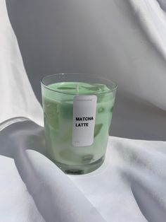 a candle with matcha latte label on it