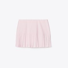 Our Pleated-Hem Tennis Skirt celebrates classic athleticism and the elegance of Sport. Made with one of our favorite performance fabrics, it is designed to wick moisture, dry quickly, retain its shape and balance superior stretch for comfort and ease of movement. It is finished with a built-in boy short. Tennis Mini Pleated Skirt, Tennis Mini Skirt With Lined Detail, Chic Mini Skort For Tennis, Classic Fitted Skort For Summer, Classic Fitted Summer Skort, Spring Pleated Swim Skirt, Classic Fitted Skort With Pleated Hem, Classic Fitted Pleated Skort, Classic Fitted Pleated Waist Skort