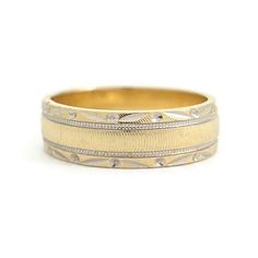 Vintage 1940's Two-Tone Etched Floral Wedding Band Ring 14K Yellow Gold, 5.57 Gr This is a beautiful ring that could be worn as a wedding band or statement ring. Please let us know if you have any questions. Circa: 1940's Metal: 14K yellow and white gold Weight: 5.57 grams Stamped: 14K Size: 8.5 (can be slightly stretched for a small fee) Width: 6 mm Classic Wide Band Diamond Wedding Ring, Heirloom 14k Gold Wedding Band Thick Shape, Antique Engraved Rings For Marriage, Stamped 14k Round Band Engraved Ring For Marriage, 14k Stamped Round Band Engraved Ring For Marriage, Ceremonial Wedding Rings With Decorative Band, Heirloom Thick Band Ring For Anniversary, Heirloom Anniversary Ring With Thick Band, 14k Stamped Engraved Ring For Marriage