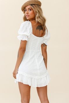 White eyelet embroidery dress.Short puff sleeves.Sweetheart neckline with tie.Gathering over bust.Frill and ruffle hem.Zipper in back. Our Hayden dress is guaranteed to get everyone's attention. It's channelling ALL the milkmaid vibes and we are here. for. it. We are obsessed with those super sweet puff sleeves and sweetheart neckline. Perfect for a flirty first date teamed with tan cowgirl boots and a headscarf. MODEL INFOModel is wearing size XSHeight: 5’6”Bust: 33”Waist: 25”Hips: 37 White Mini Dress With Ruffles And Puff Sleeves, Feminine White Mini Puff Sleeve Dress, White Ruffled Mini Dress With Puff Sleeves, White Puff Sleeve Feminine Mini Dress, White Puff Sleeve Mini Dress With Lace Trim, Frills And Ruffles, Yellow Bridesmaids, White Dresses For Women, Mini Dress Casual