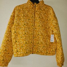 New With Tags Brand New Nwt Sonoma Quilted Jacket Exterior 100% Cotton Interior 65% Polyester, 35% Cotton Floral Pattern Quilted Double Stitch Mock Neck Collar (Can Be Folded Down) 2 Pockets Zipper Closure Hardware: Bronze Color: Yellow/Orange Blend Size: Medium Retail $74 Asking $42 Reasonable Offers Accepted Yellow Spring Outerwear With Pockets, Spring Yellow Outerwear With Pockets, Spring Yellow Floral Print Outerwear, Casual Yellow Outerwear For Spring, Casual Yellow Spring Outerwear, Casual Yellow Floral Print Outerwear, Spring Mustard Outerwear With Pockets, Mustard Outerwear With Pockets For Spring, Trendy Mustard Outerwear For Spring