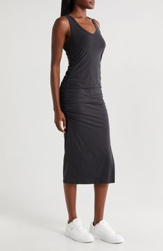 This essential midi dress is so versatile you can wear it over your swimwear during the day and out to dinner later. The deep neckline and the side slits give it breezy wearability so you can wear it again and again. 46" length (size Medium) Slips on over head V-neck Sleeveless Side slits Unlined 94% lyocell, 6% elastane Machine wash, tumble dry Made in the USA of imported fabric Versatile Summer Dress For Night Out, Summer Midi Dress For Night Out With Ruched Back, Summer Midi Dress With Ruched Back For Night Out, Bodycon Midi Dress With Side Slits For Summer, Sleek Knee-length Midi Dress For Summer, Stretch Ruched Midi Dress For Beach, Summer Knee-length Midi Dress With Ruched Back, Summer Midi Dress With Ruched Back, Sleek Summer Midi Dress With Side Slits