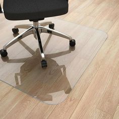 an office chair sitting on top of a hard wood floor