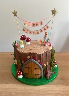 a birthday cake with a fairy scene on it