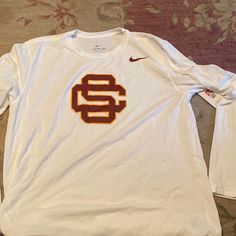 Brand New! Dri Fit Long Sleeve! White Long Sleeve T-shirt For College, White Long Sleeve College T-shirt, Nike Long Sleeve Tops Team Spirit, Nike Long Sleeve Tops With Team Spirit, Nike Long Sleeve Tops For Team Spirit, White Sporty Shirt For College, Sporty White Shirt For College, Red Nike Tops With Team Spirit, Nike Long Sleeve Cotton Shirt