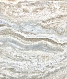 a close up view of a marble countertop with white and gray swirls on it