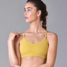 Glyder Women's Action Sports Bra Energy Bra: Antique Moss. The Energy Bra Was Created To Be Supportive And Functional. With A Minimalistic, Smooth Scoop Neck Front, And A Strappy Back, This Versatile Style Not Only Looks Impressive, But Offers Sturdy Support For All Levels Of Training. Sporty Medium Support Bra For Loungewear, Sports Bra With Soft Touch Stretch, Soft Touch Sports Bra With Stretch, Sporty Seamless Bra For Loungewear, Sporty Sports Bra With Adjustable Straps For Loungewear, Sporty Bra With Soft Touch, Yellow Stretch Seamless Sports Bra, Yellow Seamless Stretch Sports Bra, Athleisure Sports Bra With Soft Touch For Gym