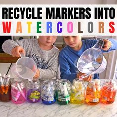 two young boys are making watercolors in their jars with the words, recycle markers into watercolors