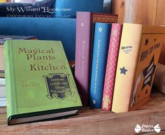 several books are sitting on a shelf in front of a couch