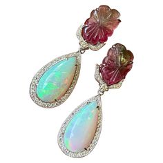 A beautiful combination of 14.66 carat bi-color Tourmaline and 16.55 Ethiopian Opal, with 1.13 carat Diamond set in solid 18K White Gold. Comes with push-pull backing. Earring Art, Opal Drop Earrings, Art Deco Earrings, Diamond Set, Ethiopian Opal, Tourmaline, Opal, Jewelry Earrings, White Gold