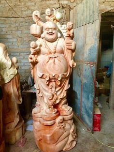 a buddha statue sitting in the middle of a room