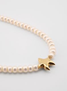 Handcrafted Starfish Pearls Necklace, embodying elegance and artistry. Drape yourself in this luxurious accessory, adorned with lustrous pearls and a delicate starfish pendant. Every piece is unique They are made by hand in Florida. Available in 16" and 18". Both sizes feature a 2" extension chain.” long Starfish-shaped Necklace With Pearl Charm For Gift, Star-shaped Pearl Charm Jewelry, Star-shaped Jewelry With Pearl Charm Gift, Star-shaped Jewelry With Pearl Charm As A Gift, Pearl Necklace With Star Charm As Gift, Pearl Necklace With Star Charm For Gift, Elegant Starfish Charm Star Necklace, Elegant Starfish Charm Necklace, Elegant Star-shaped Necklace With Starfish Charm