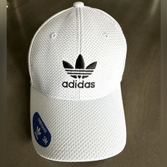 Stroll Down Main Street In This Lightweight Sporty Adidas Cap. This Hat Is A Size S/M And Has An Elastic Stretch Fit. Pair With Leggings And Tee Or Crop And Skort, Anyway You Will Look And Feel Sporty While Shielding The Sun! Sporty White Baseball Cap For Spring, Adidas Sporty Hats For Spring, Adidas Sporty Hats For Summer, Adidas Snapback Hat For Summer, Adidas White Curved Brim Hat, Adidas White Baseball Cap For Streetwear, White Adidas Sporty Baseball Cap, Casual Adidas Breathable Hats, Adjustable White Adidas Hat