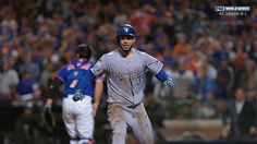 a baseball player is running on the field