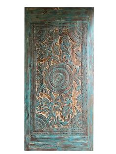 an old wooden door with ornate designs on it