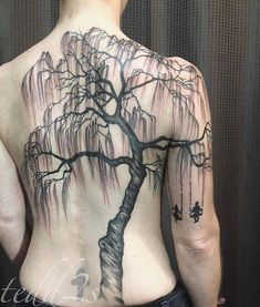 a man with a tree tattoo on his back