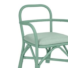 a green chair with a cushion on the seat and backrest, in front of a white background