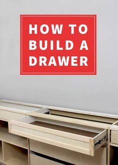 a red sign that says how to build a drawer in front of a white wall