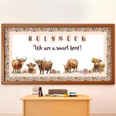 there are three cows that are standing in front of a sign with the words, we are a smart herd