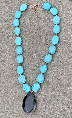 Back to Blue Turquoise Magnesite & Agate Pendant Necklace Barse Genuine Agate Genuine Turquoise Magnesite Genuine Hematite & Copper Genuine Bronze Lobster Clasp Closure Crafted and Finished By Hand CCRUN03MUC Approximate Measurements: Length- 16"-18"+ 2" Extender; Pendant Slab Slice- 1 3/4" Live your life in color with this beautiful statement pendant necklace. Pair this with a simple white V-neck t-shirt, white jeans, a denim jacket and you will be ready for a night out on the town with Blue Turquoise Necklace With Large Teardrop Stone, Blue Chrysocolla Necklace With Large Stone, Turquoise Agate Gemstone Beads Necklace, Agate Turquoise Necklace With Gemstone Beads, Turquoise Agate Gemstone Necklace, Turquoise Chrysocolla Gemstone Beads Necklace, Teardrop Turquoise Necklace With Large Stone, Blue Chrysocolla Necklace With Stones, Bohemian Blue Turquoise Chrysocolla Necklace