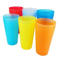 six different colored plastic cups sitting next to each other