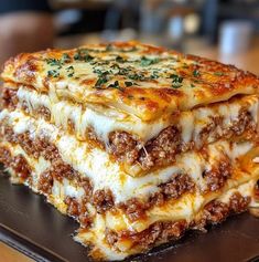 lasagna stacked on top of each other with cheese and meat in the middle